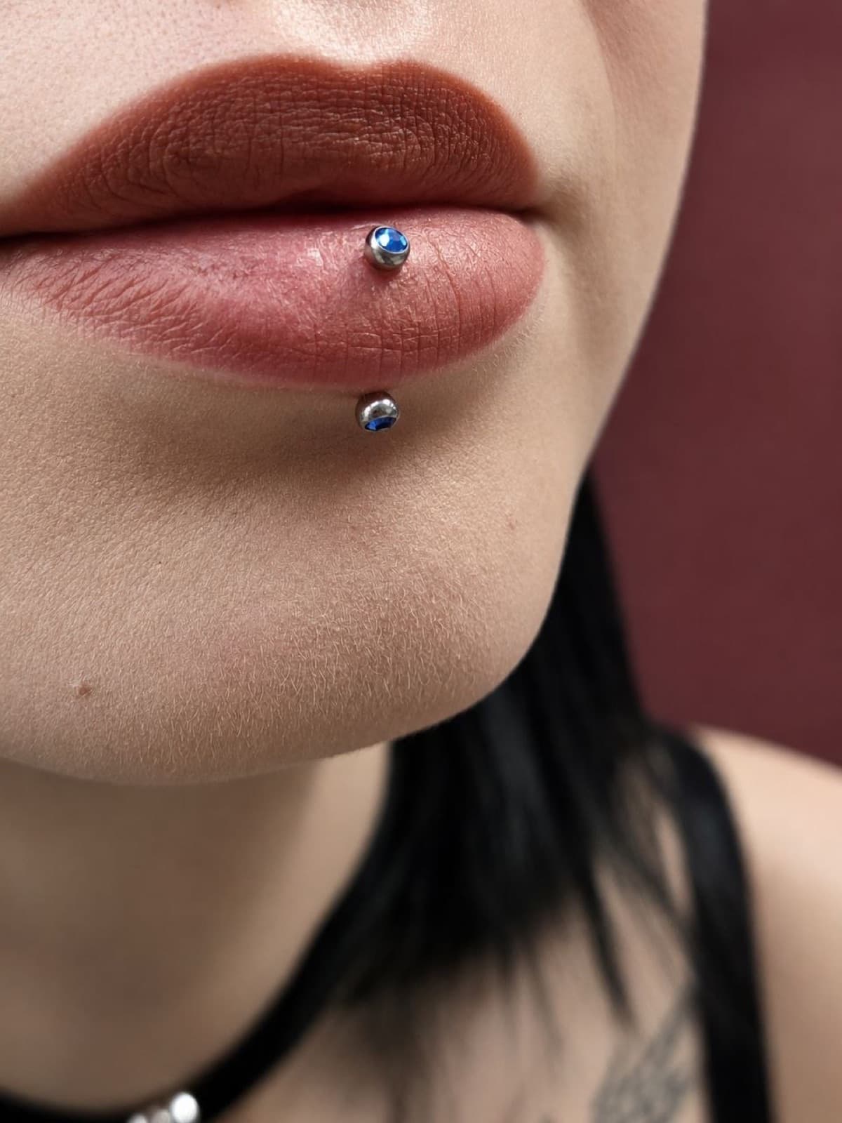 Classic labret piercing with a flat-back stud