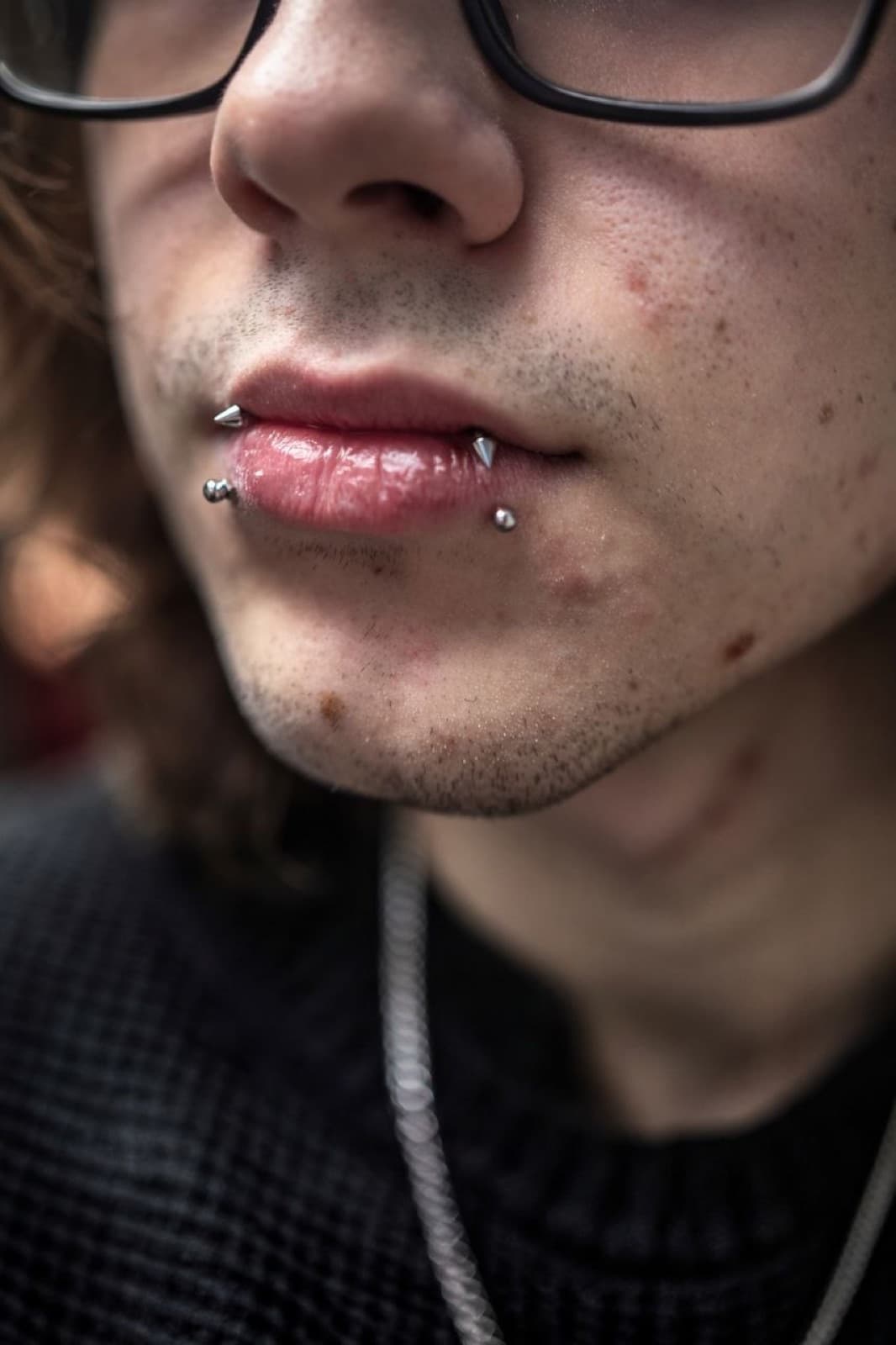Double labret lip piercing with spike jewelry